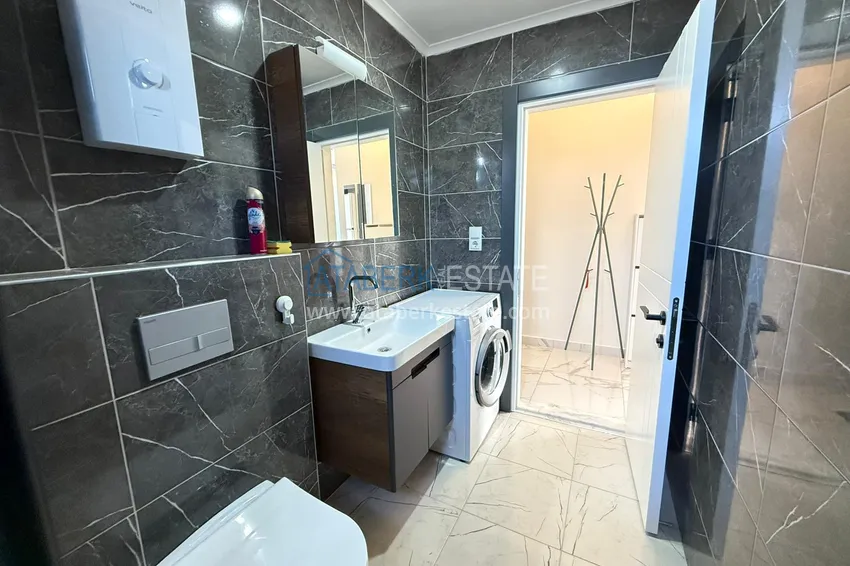 Приобрести Двухкомнатная квартира под ключ в комплексе комфорт-класса – вторая береговая линия, район Каргыджак, Алания 11