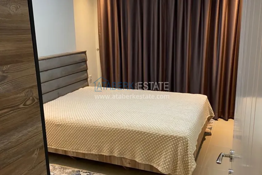 Приобрести Двухкомнатная квартира с мебелью в резиденции с отельной инфраструктурой – Алания, район Авсаллар 6 