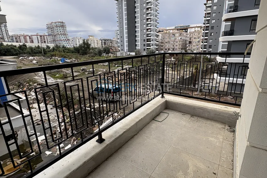 Приобрести Двухкомнатная квартира с чистовой отделкой в Махмутларе – район субботнего рынка 8 