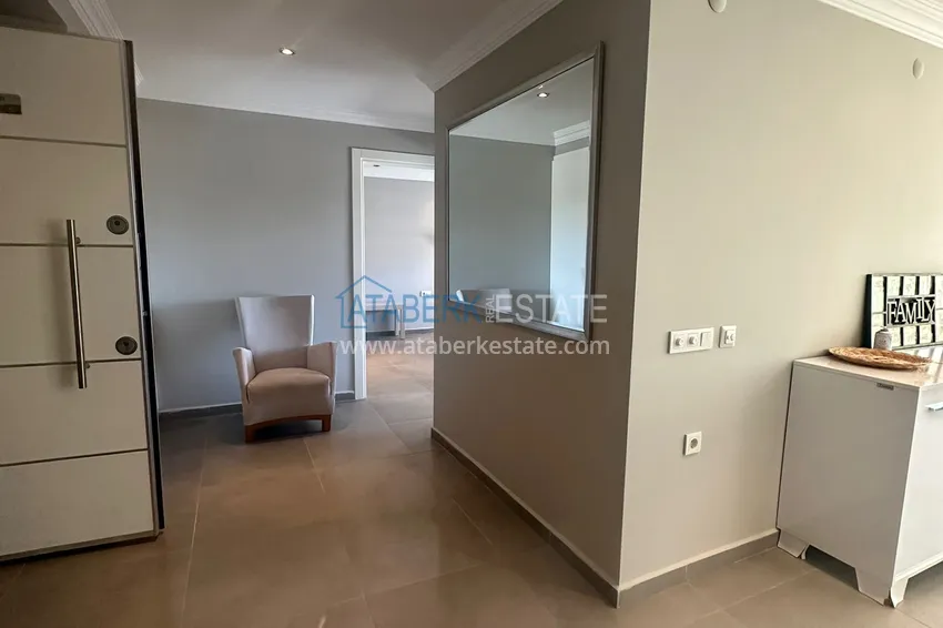 Приобрести Трехкомнатная квартира с мебелью и панорамным видом в районе Джикджилли Алания 1 