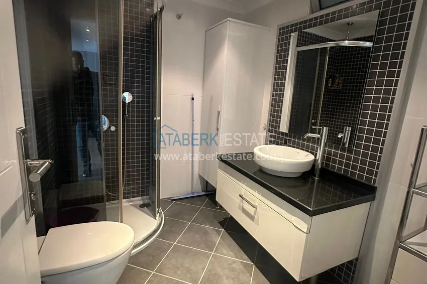 Приобрести Трехкомнатная квартира с мебелью и панорамным видом в районе Джикджилли Алания 11 