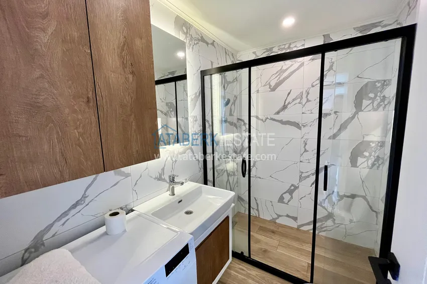 Приобрести Стильная двухкомнатная квартира с мебелью в центре Алании – первичный рынок 12 