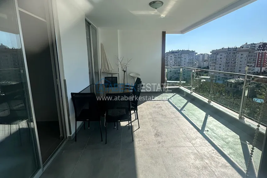 Приобрести Трехкомнатная квартира с мебелью и панорамным видом в районе Джикджилли Алания 15 