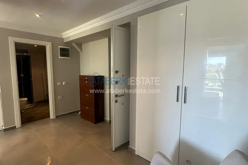 Приобрести Трехкомнатная квартира с мебелью и панорамным видом в районе Джикджилли Алания 2 