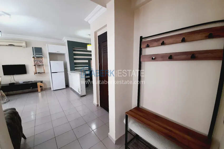 Приобрести Двухкомнатная квартира с мебелью у моря в районе Махмутлар Алания 1 