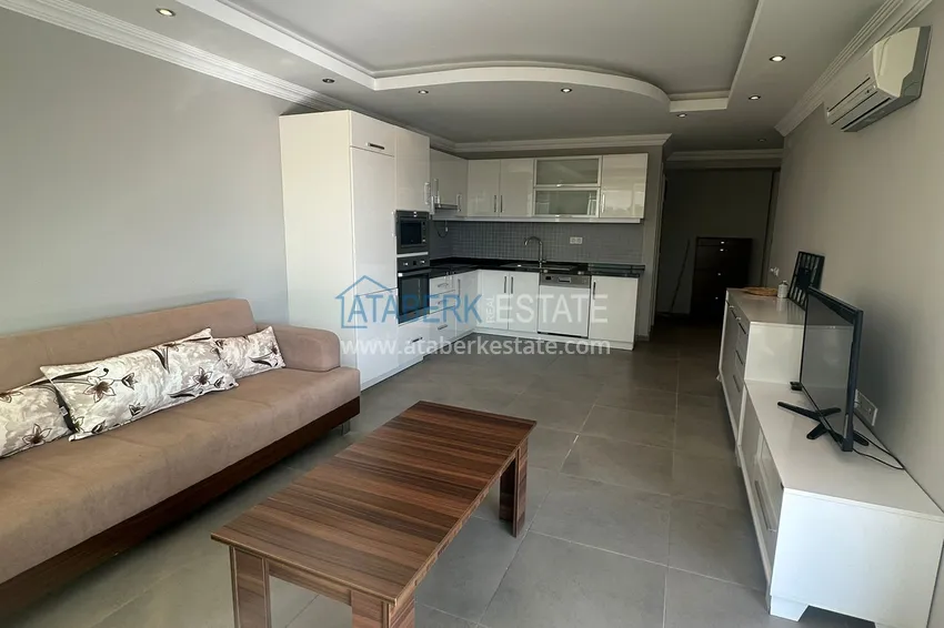 Приобрести Трехкомнатная квартира с мебелью и панорамным видом в районе Джикджилли Алания 4 