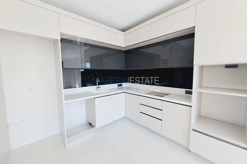 Приобрести Просторная двухкомнатная квартира 89 м2 в элитном комплекс-отеле – Алания, район Тюрклер 3 