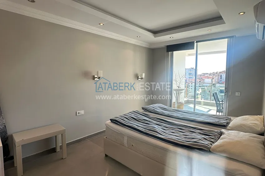 Приобрести Трехкомнатная квартира с мебелью и панорамным видом в районе Джикджилли Алания 9 