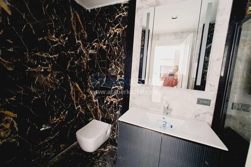 Приобрести Просторная двухкомнатная квартира 89 м2 в элитном комплекс-отеле – Алания, район Тюрклер 9 