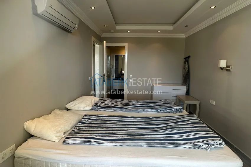 Приобрести Трехкомнатная квартира с мебелью и панорамным видом в районе Джикджилли Алания 10 