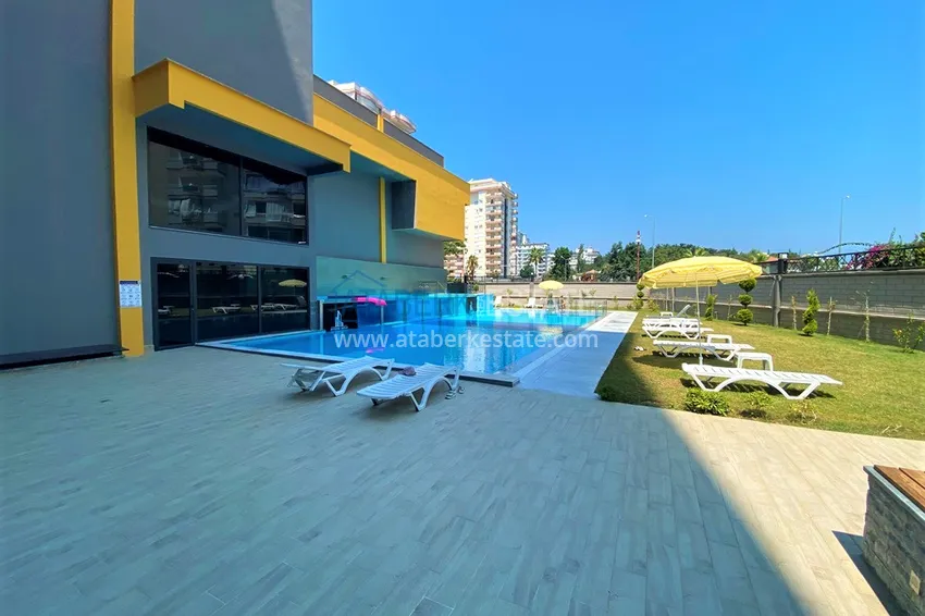 Трехкомнатная квартира с панорамным видом на море и горы в центре Махмутлара 10 