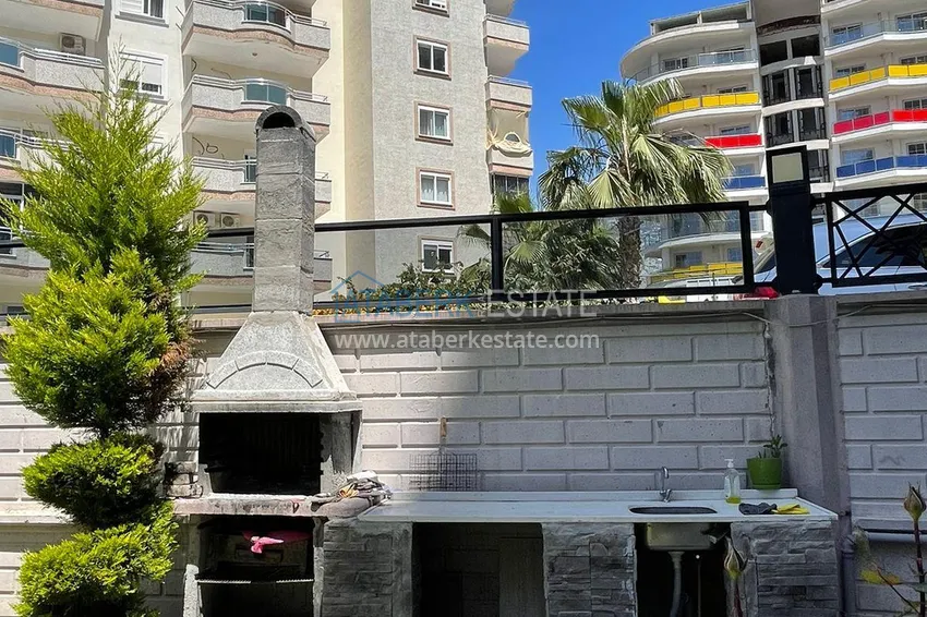 Трехкомнатная квартира с панорамным видом на море и горы в центре Махмутлара 12 