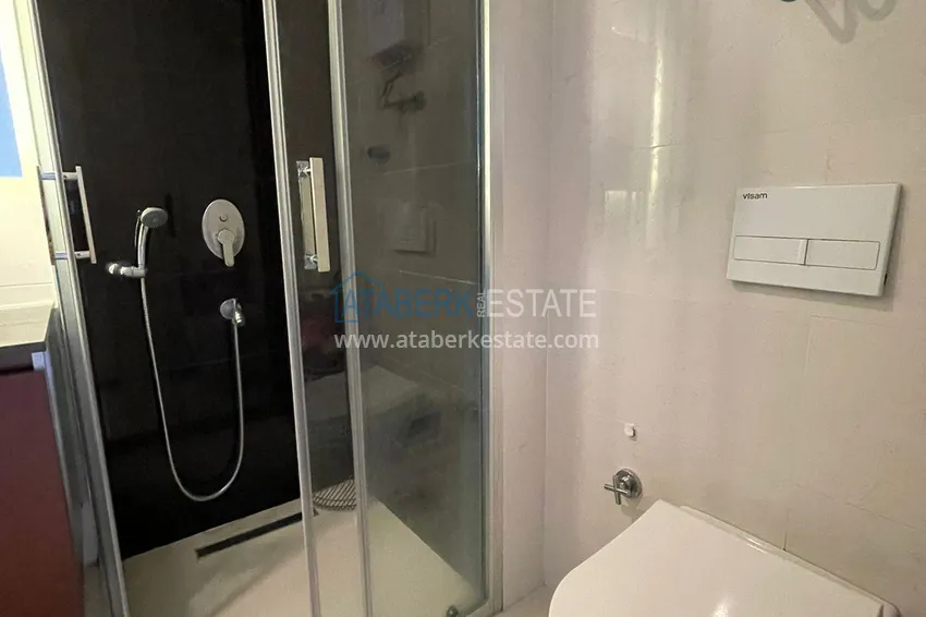 Приобрести Трехкомнатная квартира с панорамным видом на море и горы в центре Махмутлара 13 