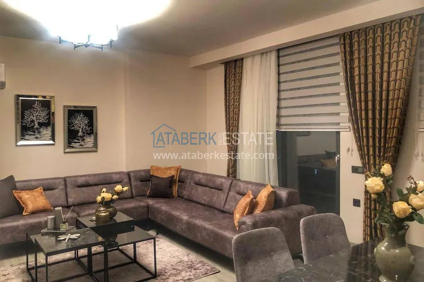 Приобрести Трехкомнатная квартира с панорамным видом на море и горы в центре Махмутлара 4 