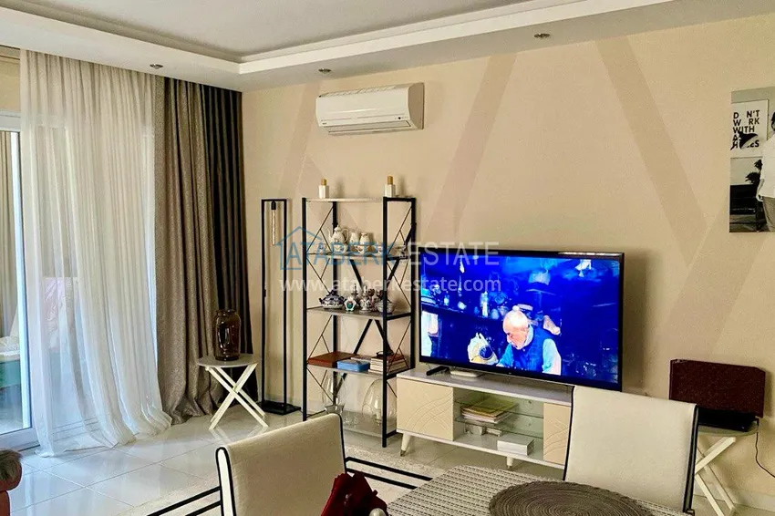 Приобрести Просторная двухкомнатная квартира с мебелью в Махмутларе – 250 метров от моря 4