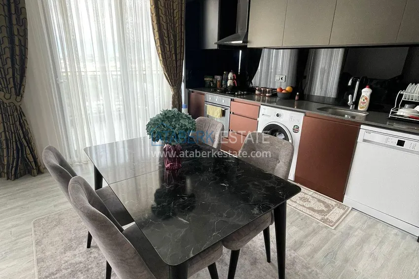 Приобрести Трехкомнатная квартира с панорамным видом на море и горы в центре Махмутлара 5 