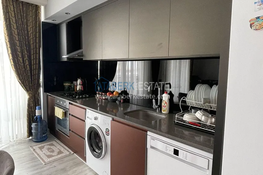 Приобрести Трехкомнатная квартира с панорамным видом на море и горы в центре Махмутлара 7 