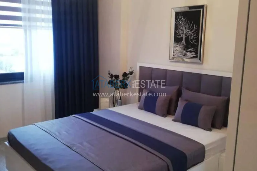 Приобрести Трехкомнатная квартира с панорамным видом на море и горы в центре Махмутлара 8 