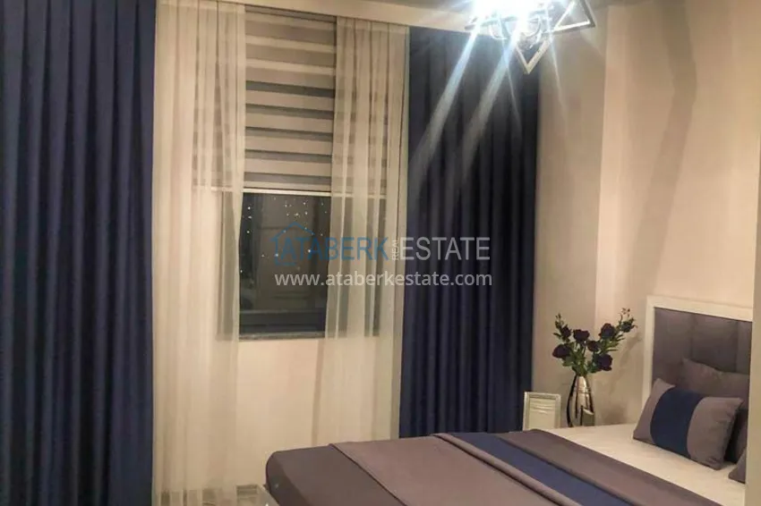 Приобрести Трехкомнатная квартира с панорамным видом на море и горы в центре Махмутлара 9 