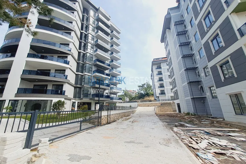 Первичная недвижимость в Алании - квартира 1+1 с чистовой отделкой в районе Авсаллар 15 