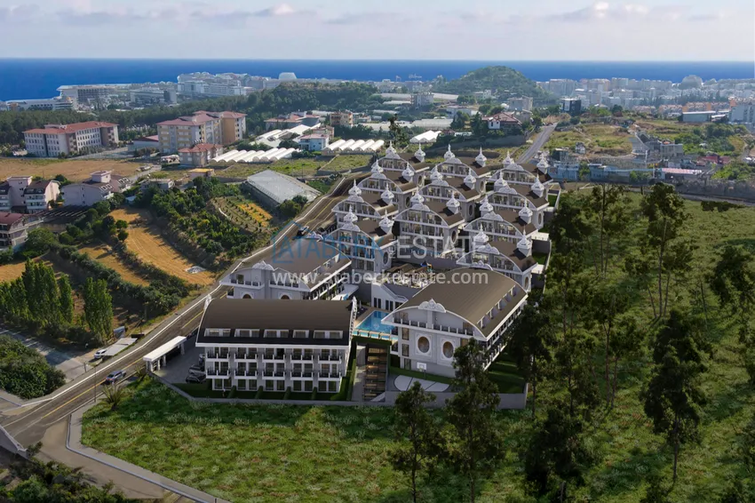 Новый архитектурный шедевр на побережье Алании, район Тюрклер – инвестиционный проект с виллами и апартаментами 1