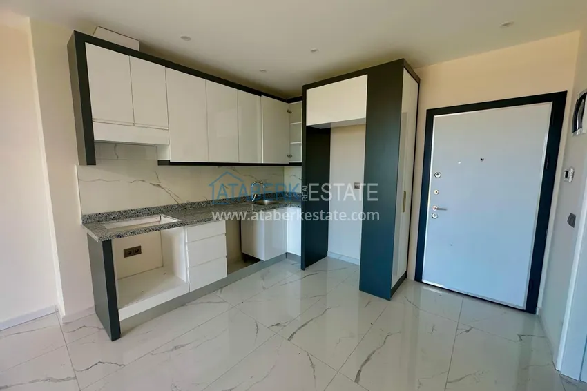 Приобрести Горящее предложение, недвижимость с видом на море – двухкомнатная квартира в Авсалларе! 1