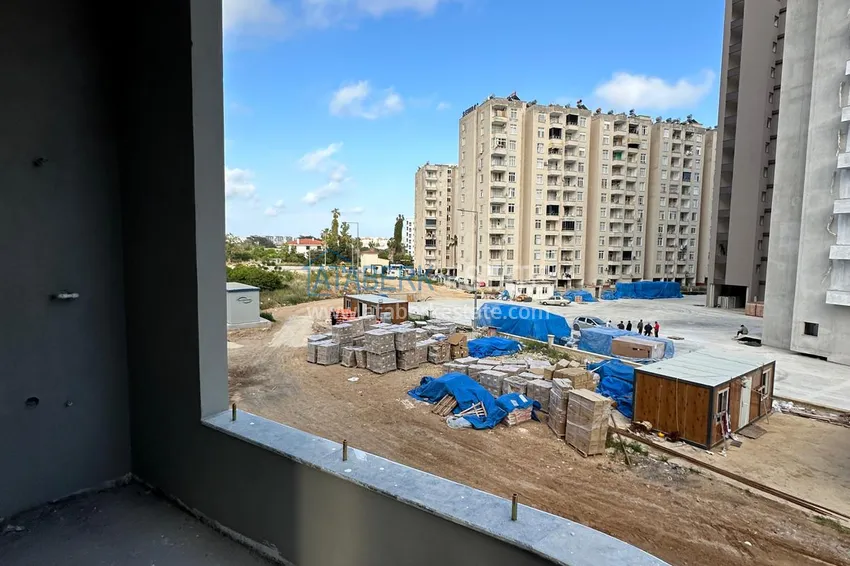 Приобрести Квартиры в Мерсине, район Томюк - от инвестора на этапе строительства. Подходит для краткосрочной аренды 12 