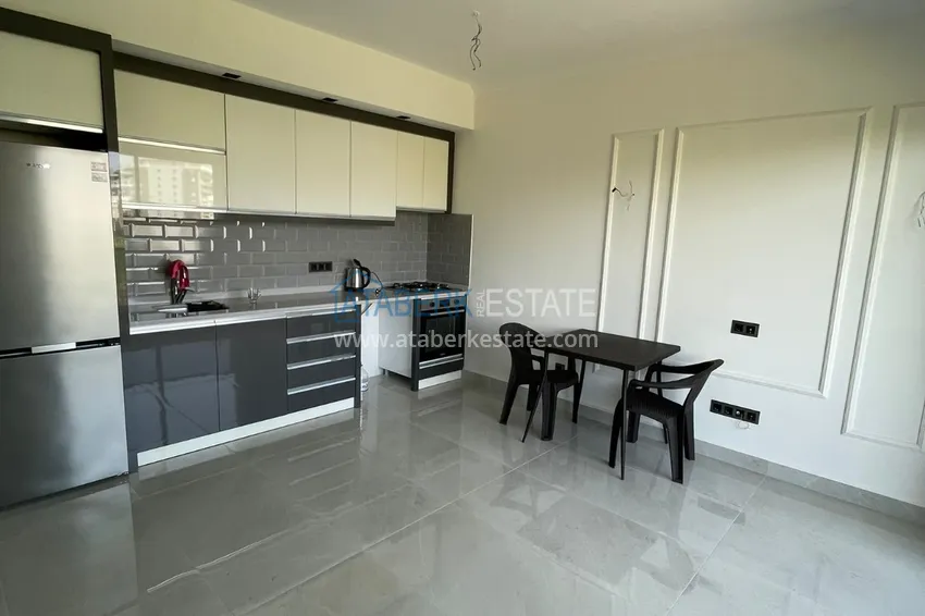 Приобрести Частично меблированная двухкомнатная квартира в районе Махмутлар, Алания 2