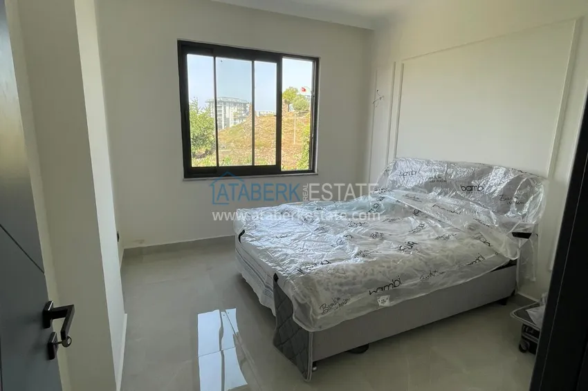 Приобрести Частично меблированная двухкомнатная квартира в районе Махмутлар, Алания 3