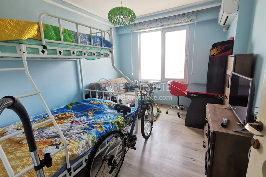 Приобрести Трехкомнатная квартира с новой мебелью и открытыми видами в Махмутларе – проспект Барбаросса  7 