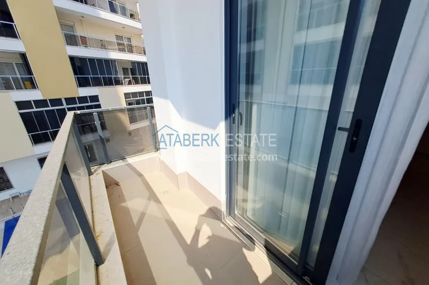 Приобрести Квартира 1+1 с двумя балконами под ключ в Махмутларе - всего в 500 м от моря 12