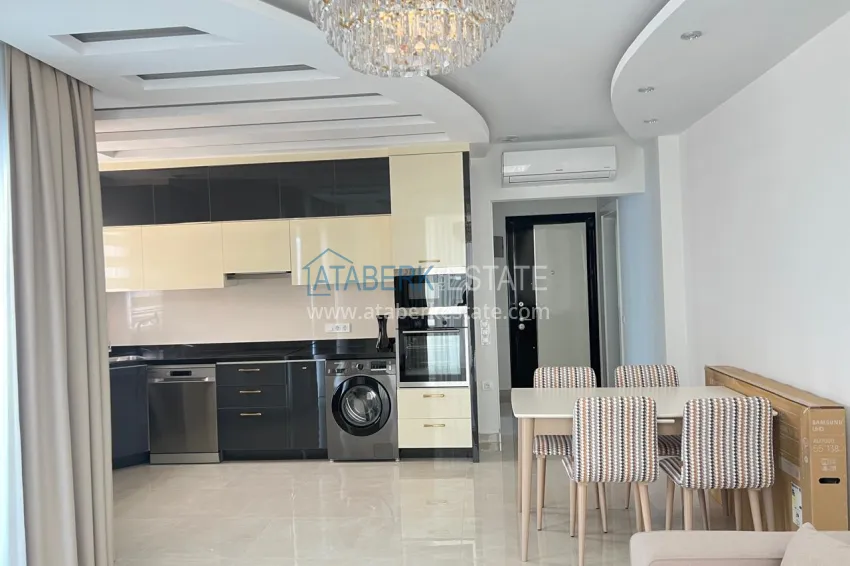 Приобрести Двухкомнатная квартира под ключ с двумя застекленными балконами в престижном комплексе - Махмутлар, Алания 2