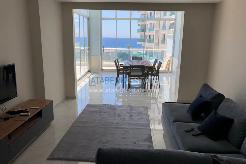 Приобрести Квартира 2+1 с террасой 70 м² в Алании, район Махмутлар - с мебелью и видом на море  2 