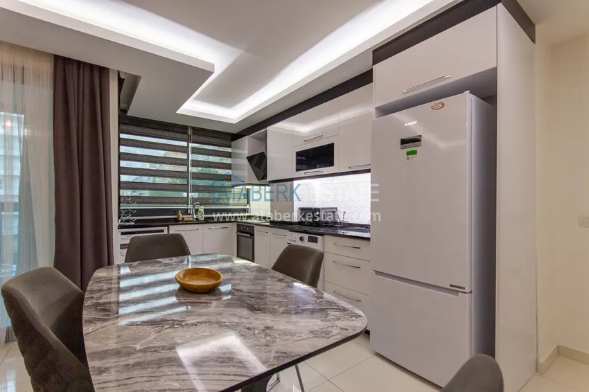 Приобрести Трёхкомнатная квартира с мебелью в Махмутларе — комфортное жильё вблизи моря 11