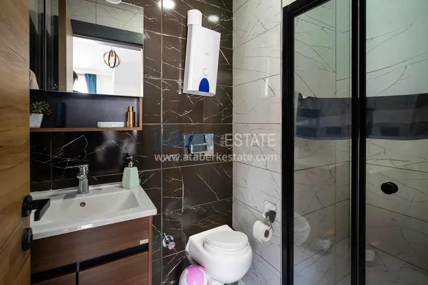 Приобрести Двухуровневая квартира 2+1 с мебелью и видом на горы в Алании, район Оба 13 