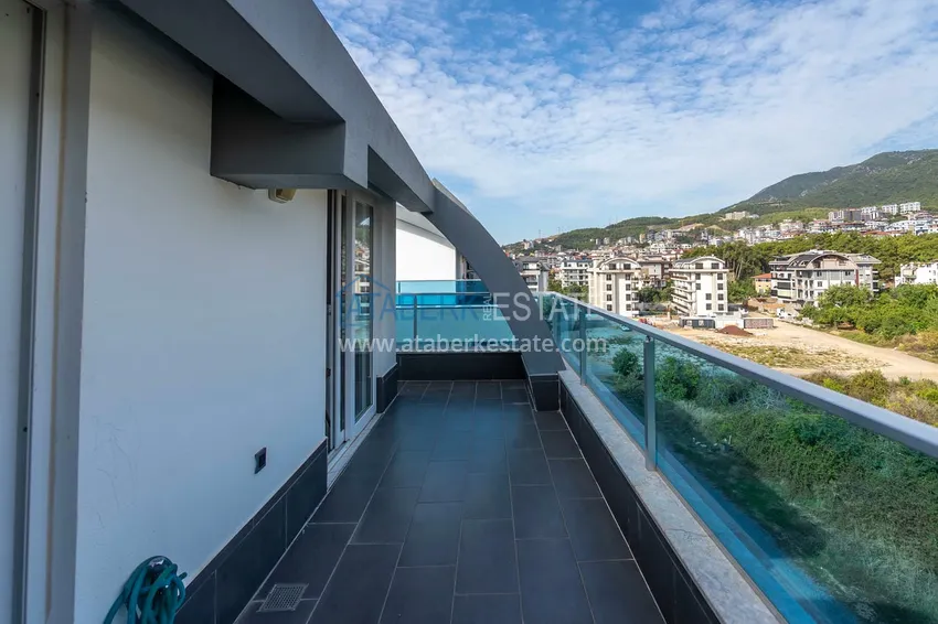 Приобрести Двухуровневая квартира 2+1 с мебелью и видом на горы в Алании, район Оба 15 