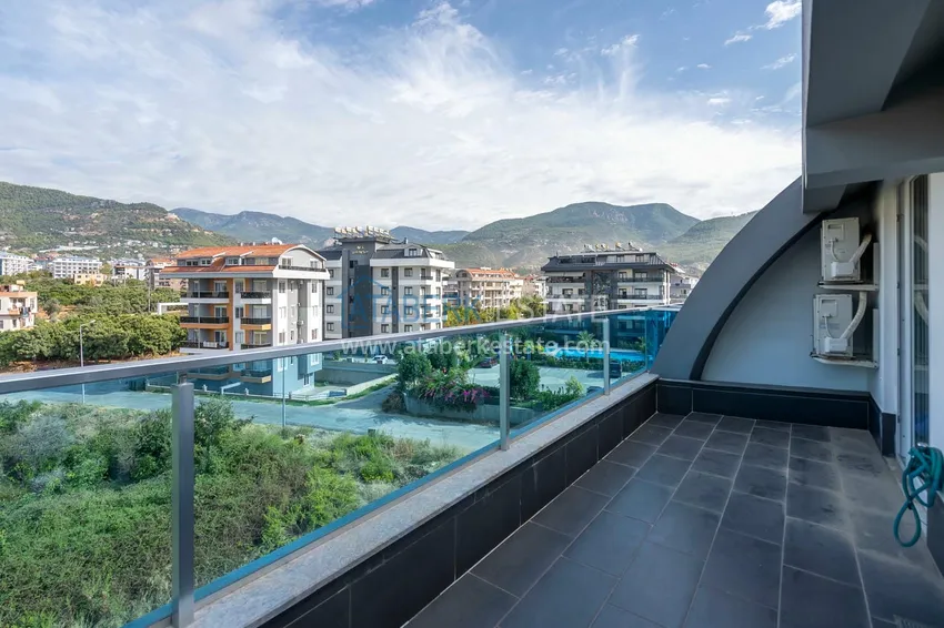 Приобрести Двухуровневая квартира 2+1 с мебелью и видом на горы в Алании, район Оба 16 