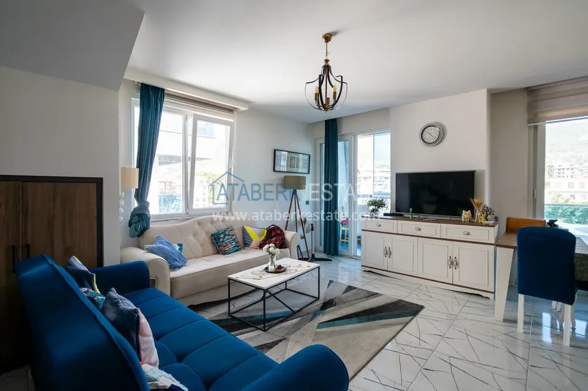 Приобрести Двухуровневая квартира 2+1 с мебелью и видом на горы в Алании, район Оба 3 