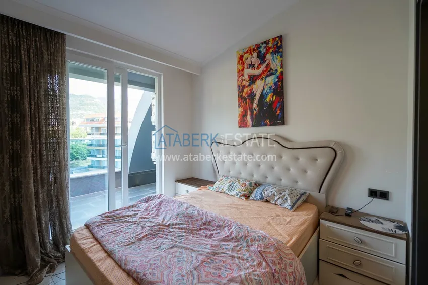 Приобрести Двухуровневая квартира 2+1 с мебелью и видом на горы в Алании, район Оба 6 