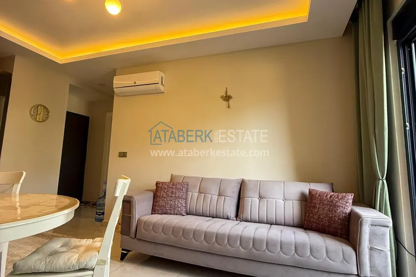 Приобрести Квартира 1+1 с мебелью от собственника в Махмутларе — ЖК с сервисом уровня отеля и частным пляжем 3 