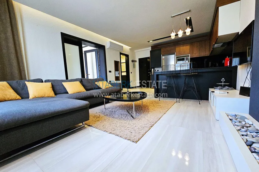 Приобрести Квартира 1+1 с мебелью в Махмутларе — 150 м от моря, проспект Барбаросса 3 