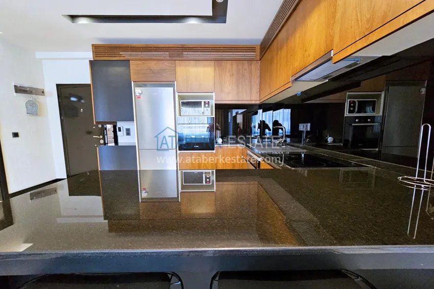 Приобрести Квартира 1+1 с мебелью в Махмутларе — 150 м от моря, проспект Барбаросса 8 