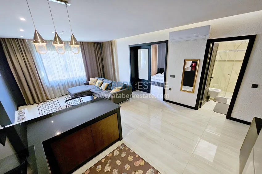 Приобрести Квартира 1+1 с мебелью в Махмутларе — 150 м от моря, проспект Барбаросса 9 