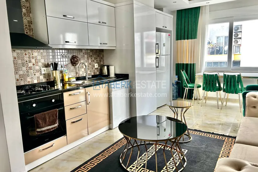 Приобрести Квартира 2+1 в Махмутларе меблированная рядом с морем - улица Барбаросса 3