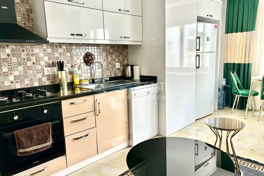 Приобрести Квартира 2+1 в Махмутларе меблированная рядом с морем - улица Барбаросса 4