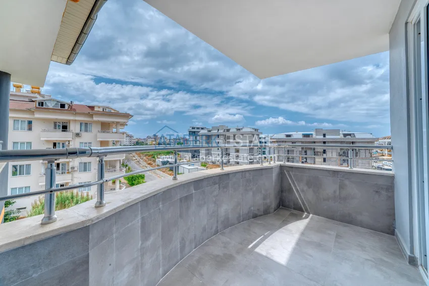 Приобрести Дуплекс 4+1 в Алании, район Оба - меблированный пентхаус под ВНЖ 12 