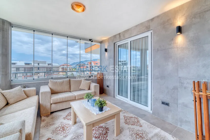 Приобрести Дуплекс 4+1 в Алании, район Оба - меблированный пентхаус под ВНЖ 8 