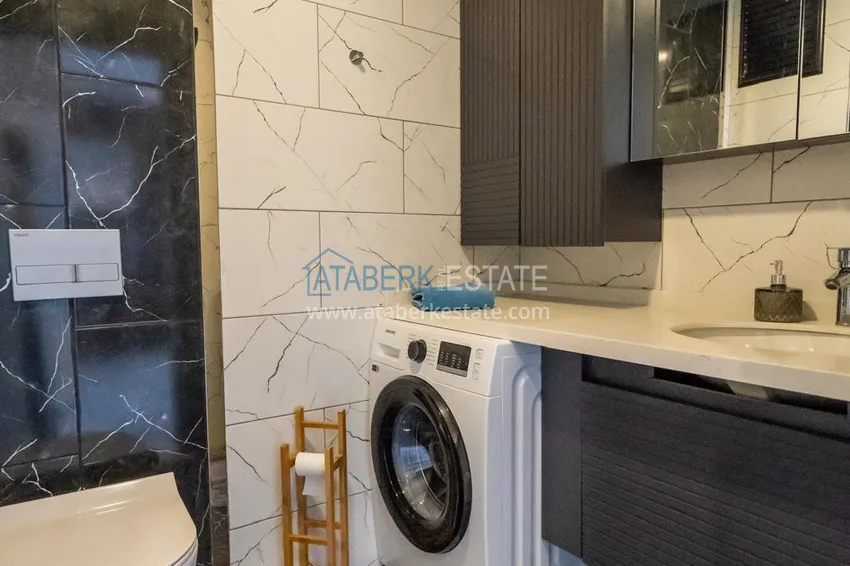 Приобрести Двухкомнатная квартира с новой мебелью в центр Махмутлара, район субботнего рынка 14 