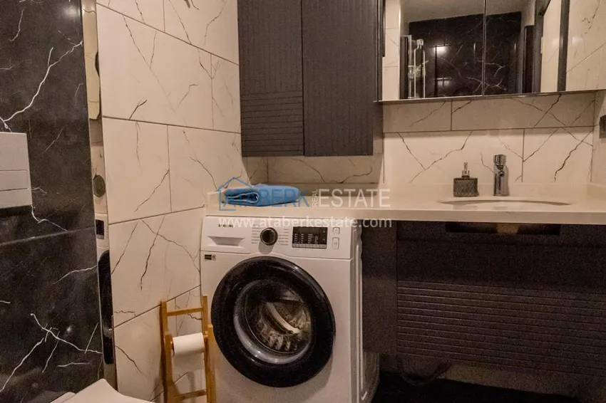 Приобрести Двухкомнатная квартира с новой мебелью в центр Махмутлара, район субботнего рынка 15 