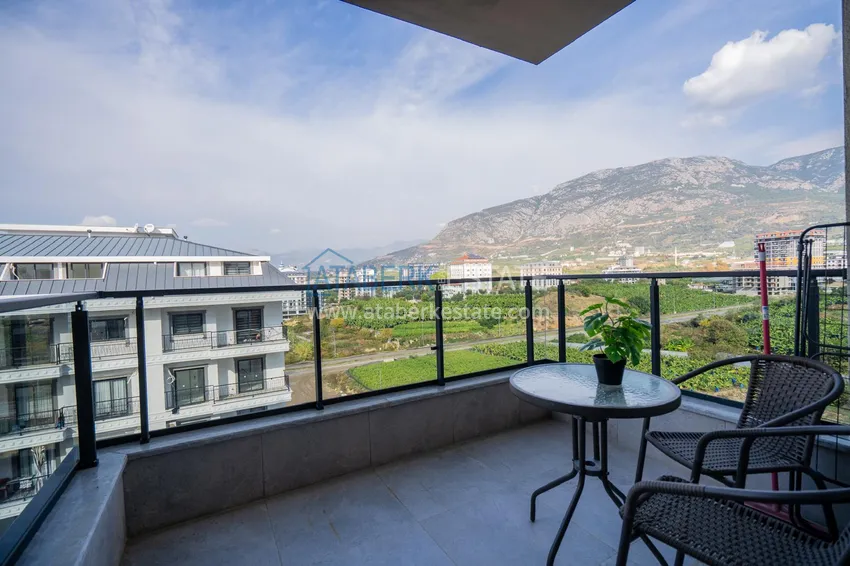 Приобрести Двухкомнатная квартира с новой мебелью в центр Махмутлара, район субботнего рынка 17 